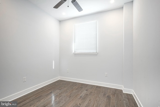 spare room with a ceiling fan, recessed lighting, dark wood finished floors, and baseboards