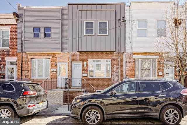 multi unit property with brick siding and board and batten siding