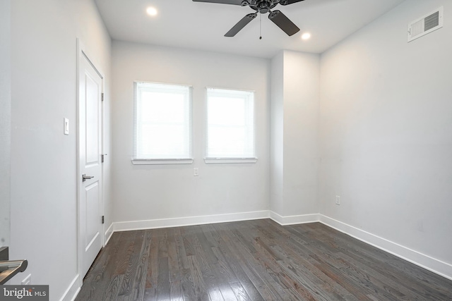 unfurnished room featuring dark wood-style floors, recessed lighting, visible vents, and baseboards