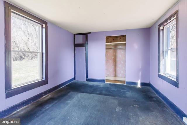 unfurnished bedroom featuring baseboards