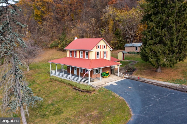 drone / aerial view featuring a view of trees