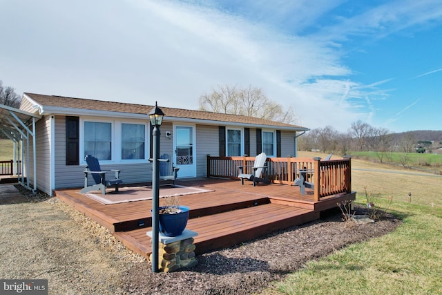 back of house featuring a deck