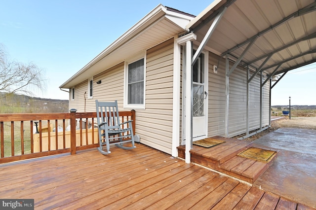 wooden terrace with a carport