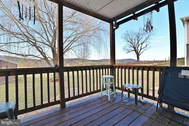 wooden terrace with a yard