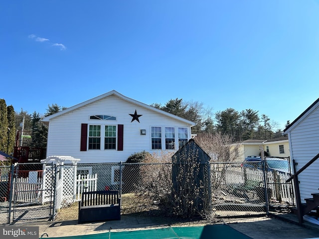 view of front of property with a gate and fence