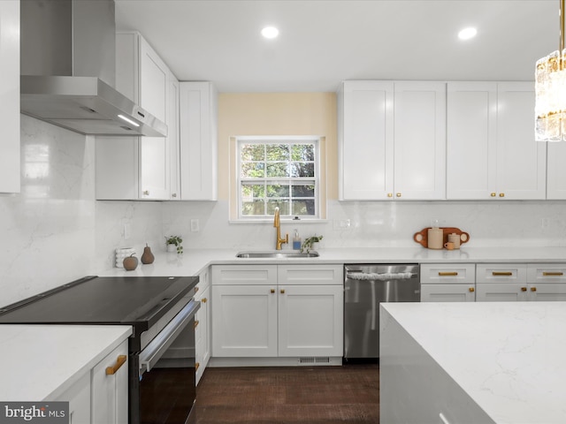 kitchen with a sink, stainless steel dishwasher, decorative backsplash, wall chimney exhaust hood, and black electric range oven