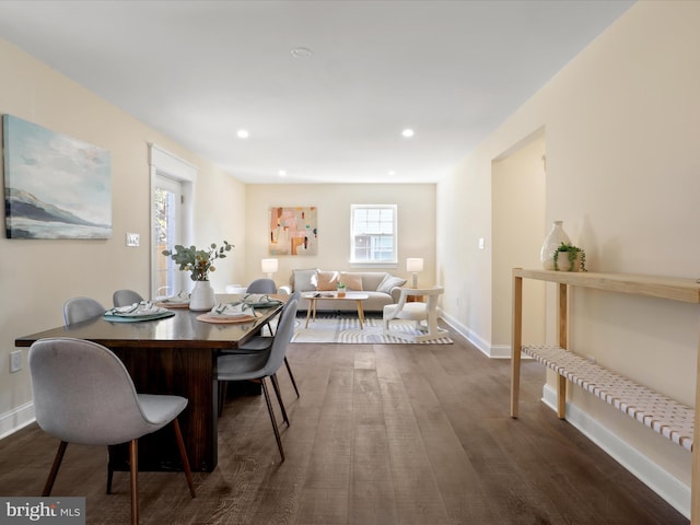 dining room with dark wood-style floors, recessed lighting, and baseboards