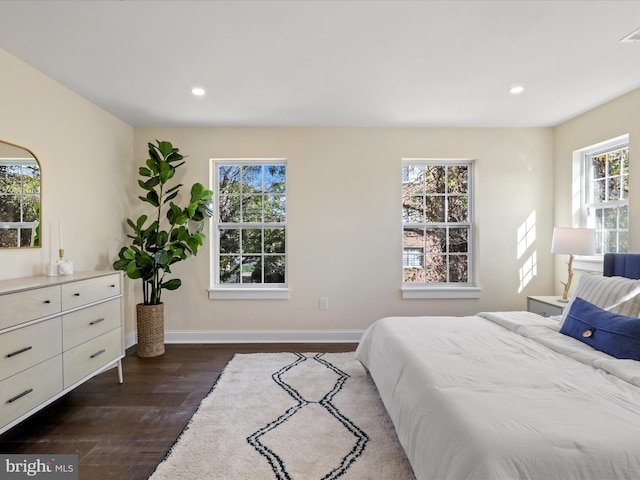 bedroom featuring dark wood-type flooring, recessed lighting, visible vents, and baseboards