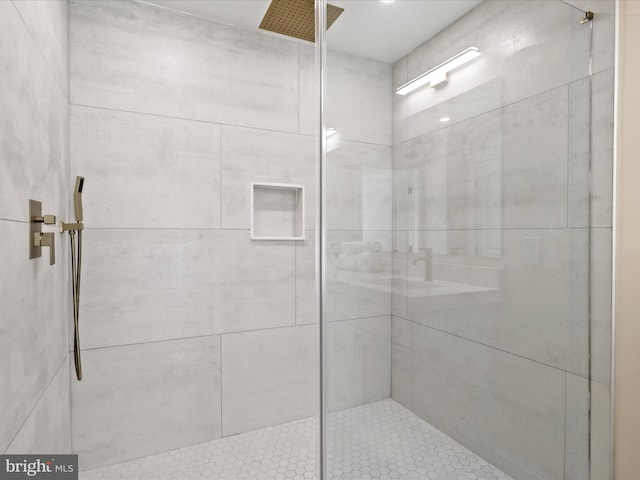 full bath featuring a tile shower