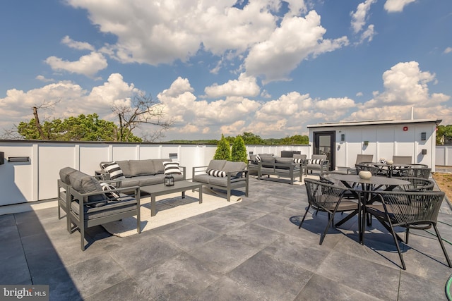 view of patio / terrace featuring an outdoor hangout area and outdoor dining space