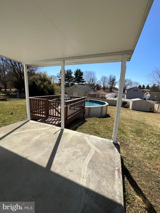 view of patio with a fenced in pool