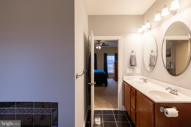 full bath with tile patterned flooring, a sink, and double vanity