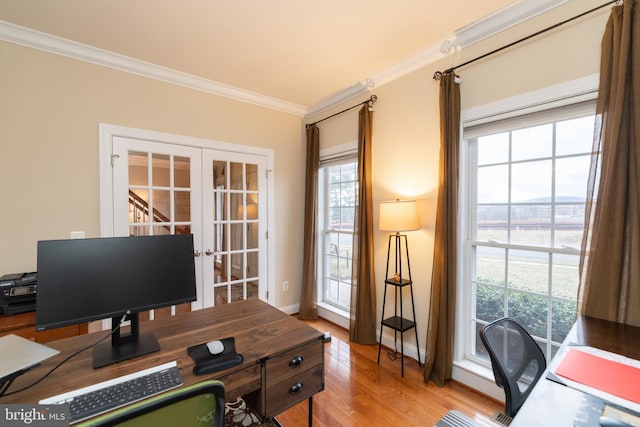 office featuring light wood-style flooring, ornamental molding, baseboards, and french doors