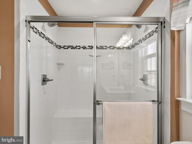 full bath with a shower stall