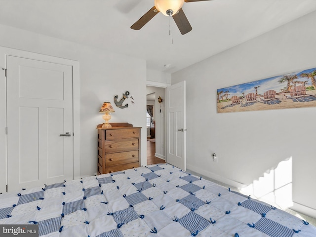 bedroom featuring baseboards and ceiling fan