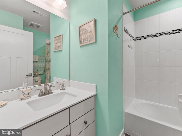 full bathroom featuring visible vents, vanity, and shower / bathtub combination