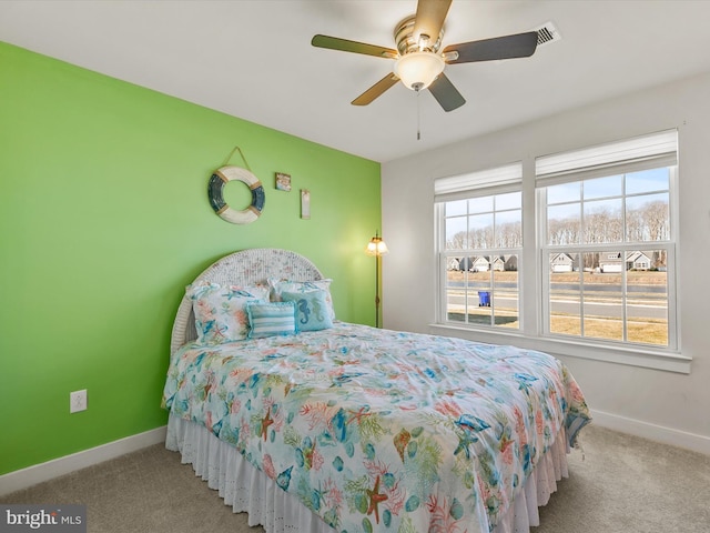 bedroom featuring carpet flooring, a ceiling fan, and baseboards