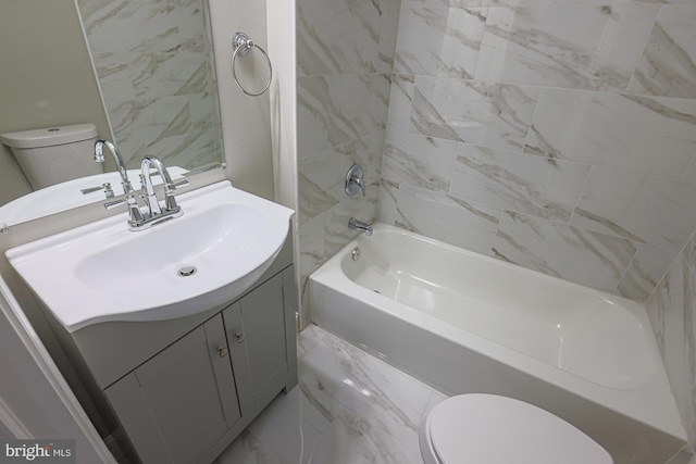 full bathroom featuring marble finish floor, shower / washtub combination, vanity, and toilet