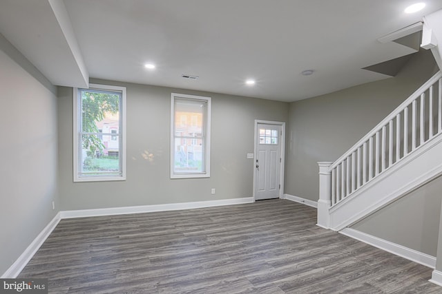 entrance foyer featuring dark wood-style flooring, recessed lighting, visible vents, baseboards, and stairs