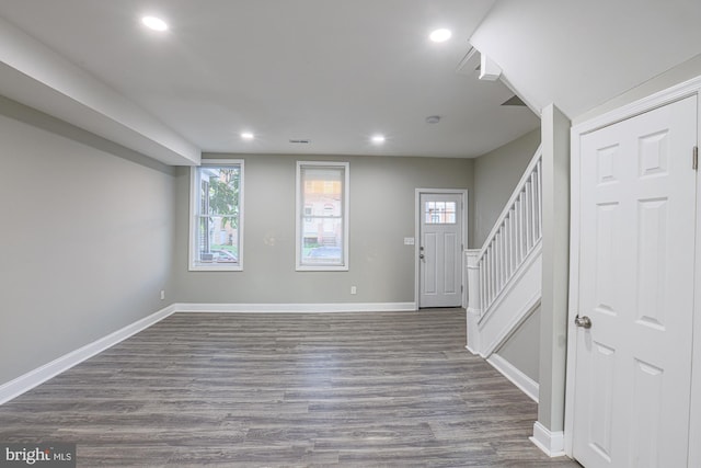 entrance foyer featuring recessed lighting, wood finished floors, baseboards, and stairs