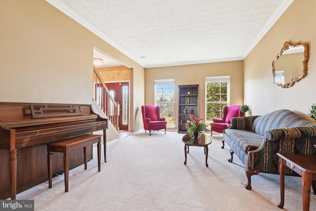 living room featuring baseboards, carpet floors, stairs, a textured ceiling, and crown molding