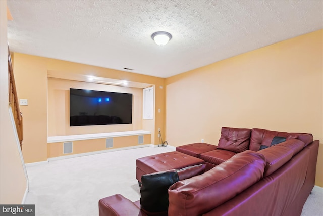 living room featuring carpet, baseboards, and a textured ceiling