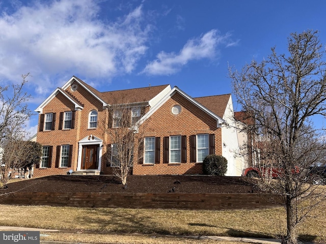 view of front of home featuring brick siding