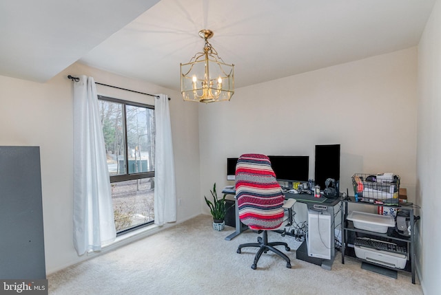 carpeted office space featuring a chandelier