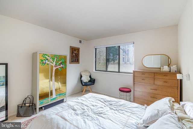 carpeted bedroom with visible vents