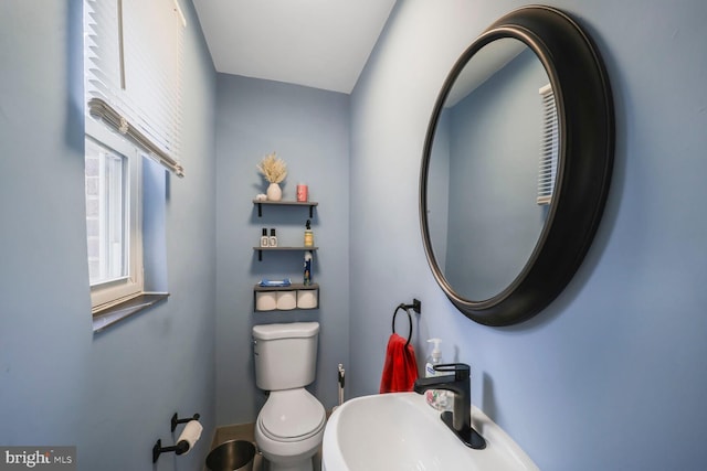 bathroom featuring toilet and a sink