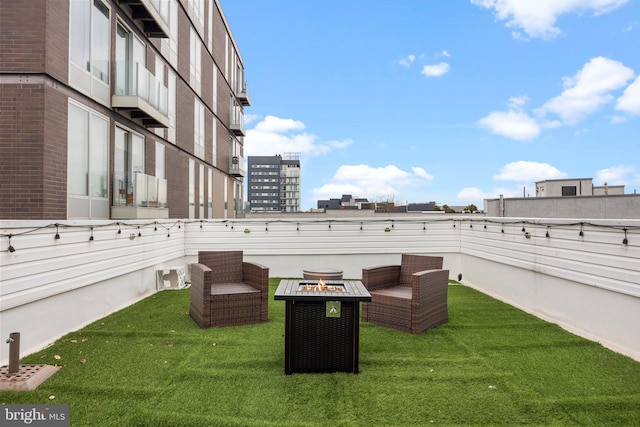 view of patio / terrace featuring an outdoor fire pit