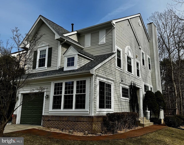 view of side of property featuring a garage and a chimney