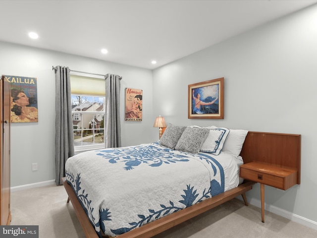 bedroom with recessed lighting, light colored carpet, and baseboards