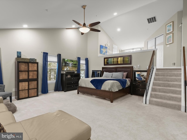 carpeted bedroom featuring high vaulted ceiling, visible vents, a ceiling fan, and recessed lighting