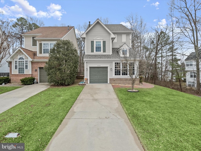 traditional-style home featuring driveway, an attached garage, a front lawn, and brick siding