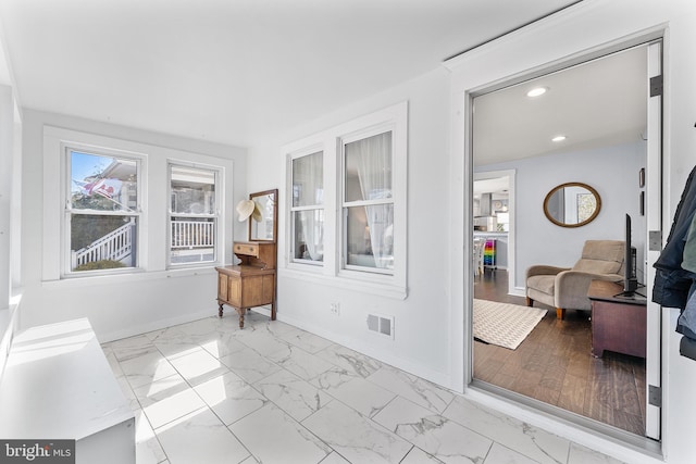 sunroom featuring visible vents