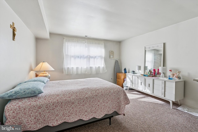 carpeted bedroom with visible vents