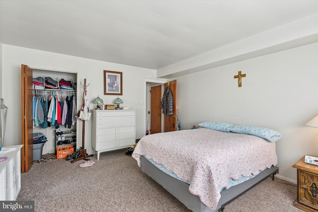 bedroom with carpet and a closet