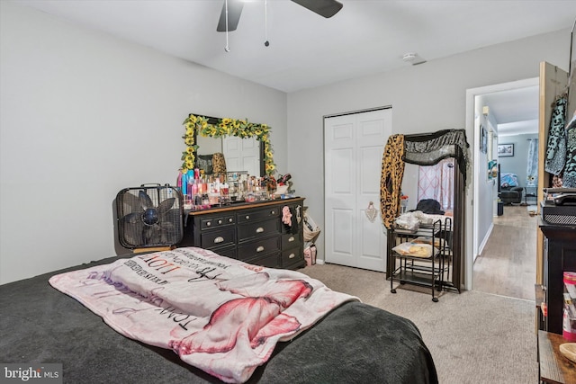 bedroom featuring ceiling fan, carpet floors, and a closet