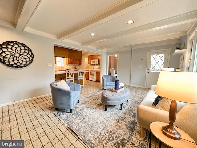 living room with recessed lighting, beamed ceiling, and baseboards