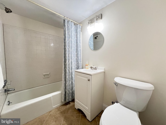 full bathroom featuring tile patterned flooring, toilet, vanity, and shower / bath combo