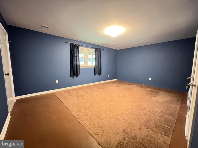 unfurnished bedroom with baseboards and visible vents