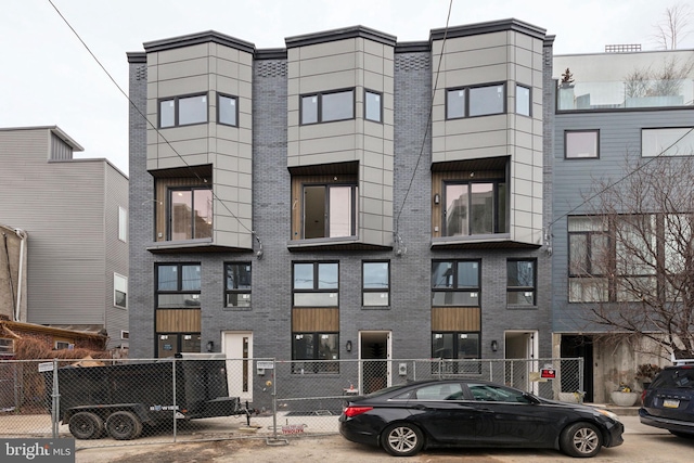 view of building exterior featuring fence