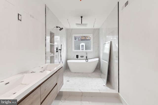 full bath with double vanity, visible vents, a soaking tub, and walk in shower