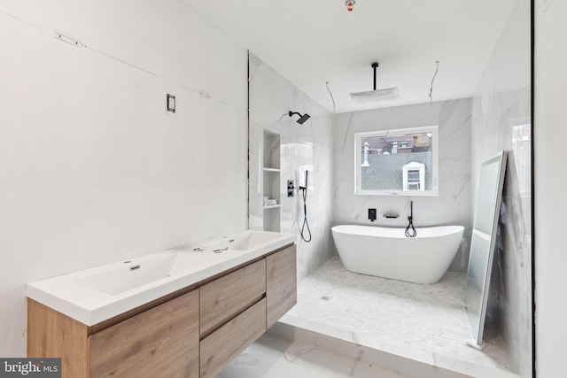 full bath featuring a soaking tub, double vanity, a sink, a walk in shower, and marble finish floor