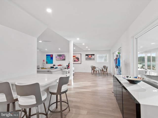 interior space featuring a healthy amount of sunlight, light wood-style flooring, and recessed lighting