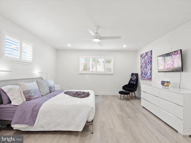 bedroom featuring light wood finished floors, multiple windows, baseboards, and recessed lighting