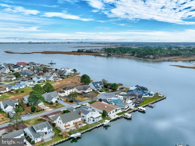 birds eye view of property with a water view and a residential view