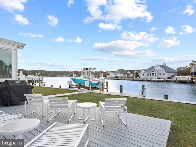 exterior space featuring a water view, boat lift, a residential view, and a yard