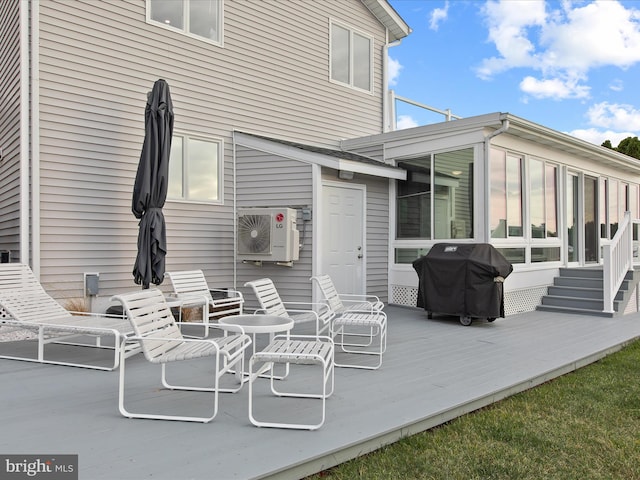 exterior space featuring ac unit, a sunroom, and a deck